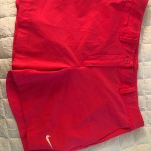 Neon pink Nike golfing shorts